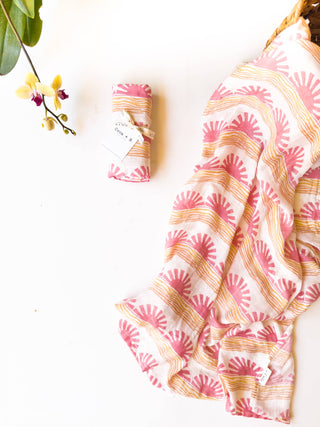 Organic Pink Sun + Wave Baby Swaddle | Coastal Nursery Decor