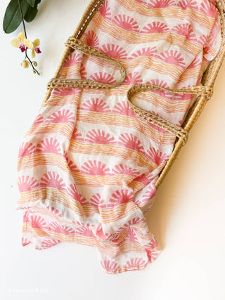 Organic Pink Sun + Wave Baby Swaddle | Coastal Nursery Decor